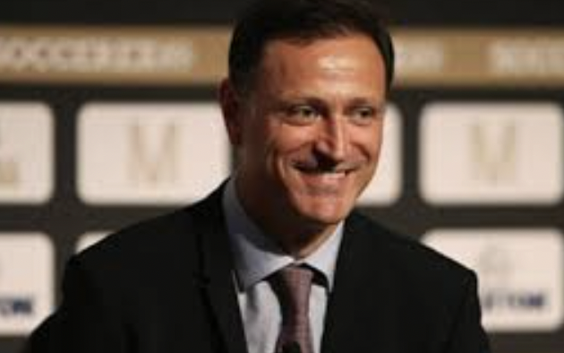 Moggio reflects the gold cup that raises the bar